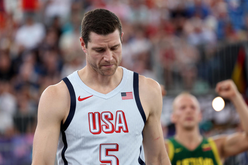 PARIS, FRANCE - AUGUST 01: Jimmer Fredette #5 of Team United States reacts after his teams loss during a Men's 3x3 basketball pool round game between the United States and Lithuania on day six of the Olympic Games Paris 2024 at Esplanade Des Invalides on August 01, 2024 in Paris, France. (Photo by Elsa/Getty Images)