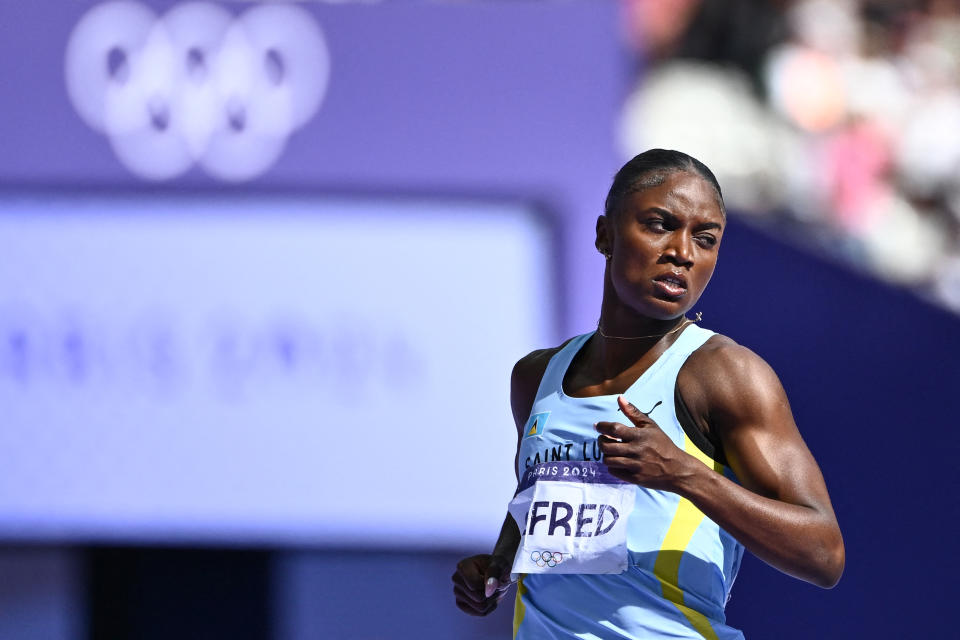 Saint Lucia's Julien Alfred reacts after competing in the women's 200m heat of the athletics event at the Paris 2024 Olympic Games at Stade de France in Saint-Denis, north of Paris, on August 4, 2024. (Photo by Jewel SAMAD / AFP) (Photo by JEWEL SAMAD/AFP via Getty Images)