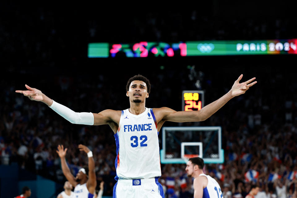 France's #32 Victor Wembanyama celebrates in the last minute in the men's quarterfinal basketball match between France and Canada during the Paris 2024 Olympic Games at the Bercy Arena in Paris on August 6, 2024. (Photo by Luis TATO / AFP) (Photo by LUIS TATO/AFP via Getty Images)