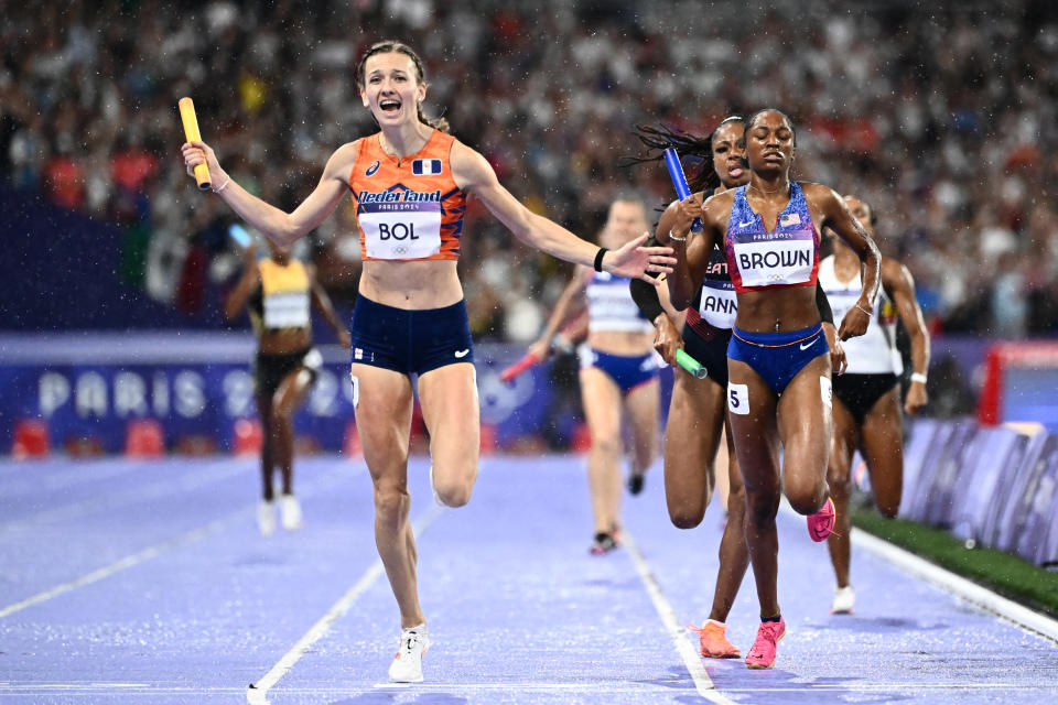 Netherlands' Femke Bol and US' Kaylyn Brown compete in the mixed 4x400m relay final of the athletics event at the Paris 2024 Olympic Games at Stade de France in Saint-Denis, north of Paris, on August 3, 2024. (Photo by Jewel SAMAD / AFP) (Photo by JEWEL SAMAD/AFP via Getty Images)