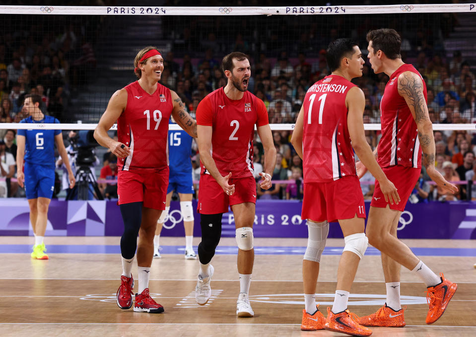 PARIS, FRANCE - AUGUST 09: Aaron Russell #2 of Team United States reacts with teammates during a Men's Bronze Medal Match between Team Italy and Team United States on day fourteen of the Olympic Games Paris 2024 at Paris Arena on August 09, 2024 in Paris, France. (Photo by Buda Mendes/Getty Images)