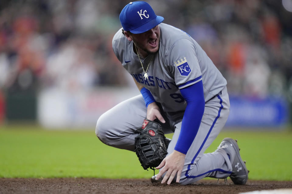 Kansas City Royals first baseman Vinnie Pasquantino reacts after injuring his right hand on a play during the eighth inning of a baseball game against the Houston Astros, Thursday, Aug. 29, 2024, in Houston. (AP Photo/Kevin M. Cox)