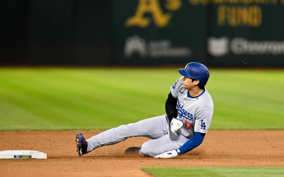 OAKLAND, CALIFORNIA - AUGUST 03: Shohei Ohtani #17 of Los Angeles Dodgers steals second base in the top of the ninth inning during the regular season game against the Oakland Athletics at the Oakland Coliseum on August 3, 2024 in Oakland, California. (Photo by Gene Wang/Getty Images)