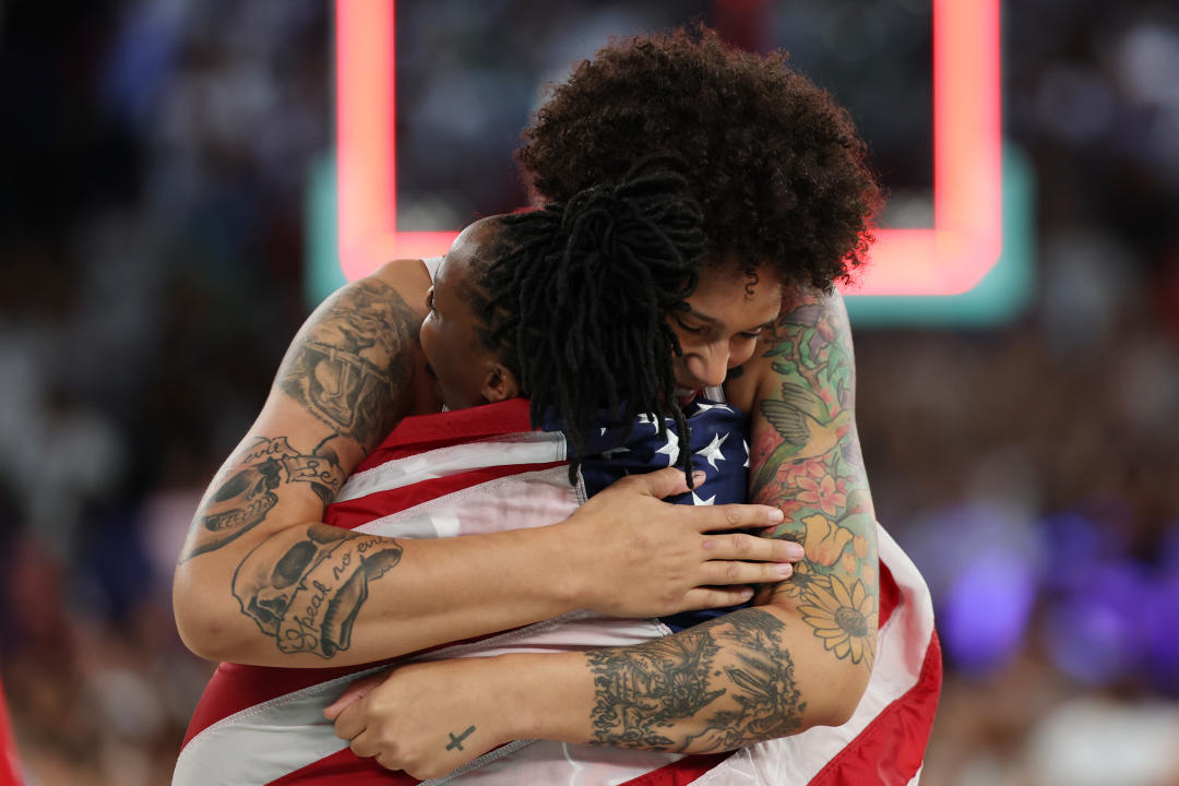 PARIS, FRANCE - AUGUST 11: Brittney Griner #15 of Team United States hugs Chelsea Gray #8 of Team United States after their team's victory against Team France during the Women's Gold Medal game between Team France and Team United States on day sixteen of the Olympic Games Paris 2024 at Bercy Arena on August 11, 2024 in Paris, France. (Photo by Gregory Shamus/Getty Images)