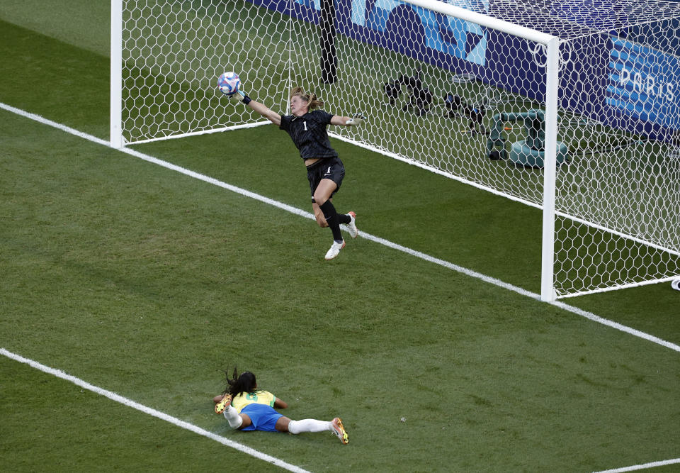 USWNT goalkeeper Alyssa Naeher dives to save a shot in extra time during the women's gold medal match against Brazil. (REUTERS/Benoit Tessier)