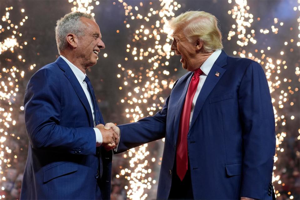 Republican presidential nominee former President Donald Trump shakes hands with Independent presidential candidate Robert F. Kennedy Jr. at a campaign rally at the Desert Diamond Arena, Friday, Aug. 23, 2024, in Glendale, Ariz. (AP Photo/Evan Vucci) (AP)