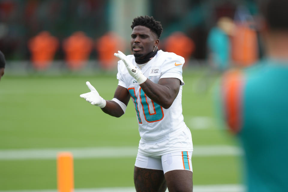 MIAMI GARDENS, FL - AUGUST 01: Miami Dolphins wide receiver Tyreek Hill (10) pumps up his fellow receivers during Dolphins Training Camp on Thursday, August 1, 2024 at Baptist Health Training Complex in Miami Gardens, Fla. (Photo by Peter Joneleit/Icon Sportswire via Getty Images)