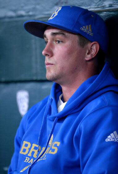 David Berg sits in the UCLA dugout during a 2015 game against Maryland