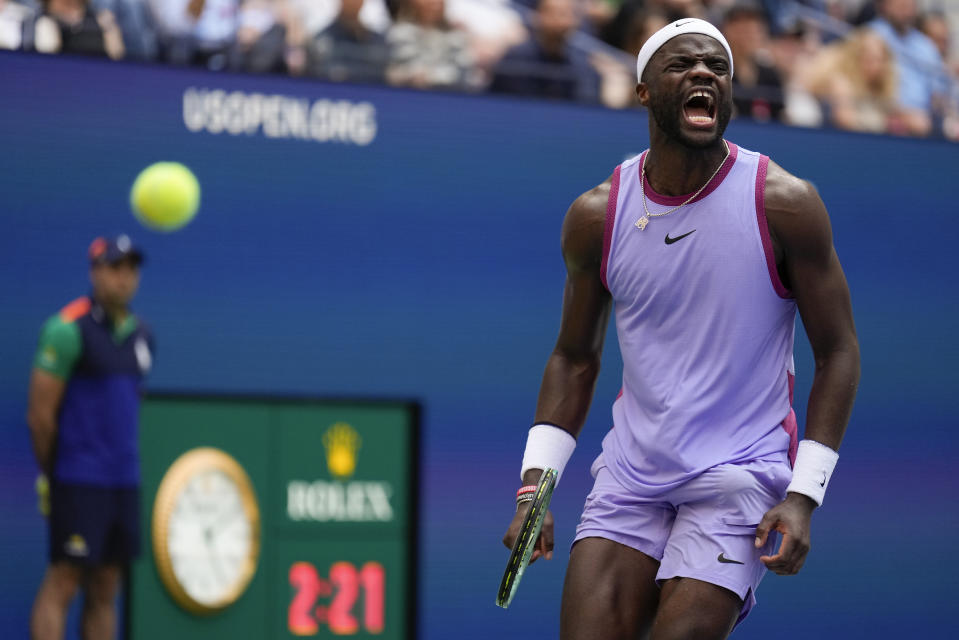 Frances Tiafoe, of the United States, reacts after scoring a point against Ben Shelton, of the United States, during the third round of the U.S. Open tennis championships, Friday, Aug. 30, 2024, in New York. (AP Photo/Seth Wenig)