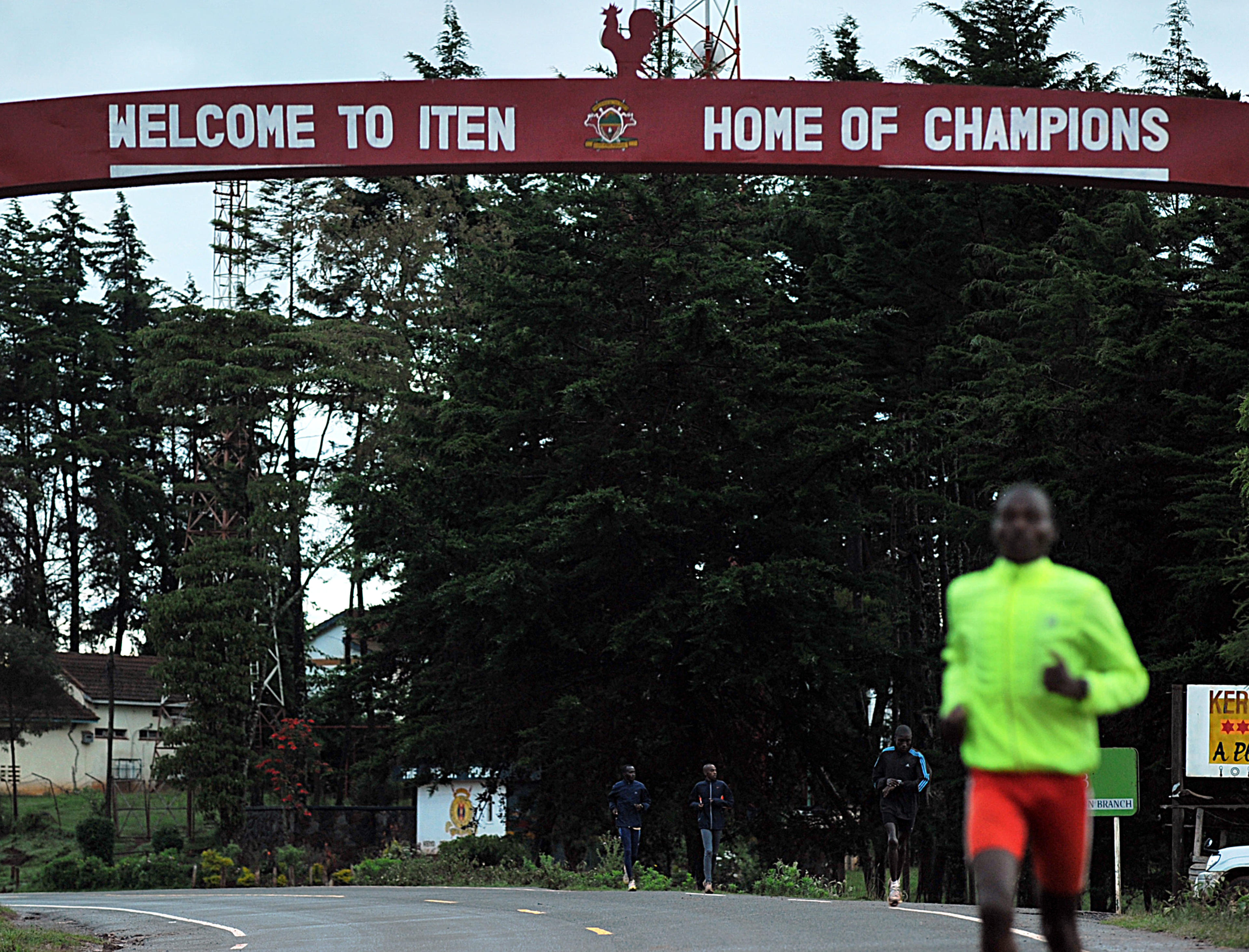 TO GO WITH AFP STORY BY Aileen Kimutai
Kenyan atheletes run during a training session on December 2, 2011 at the high-altitude town of Iten in Kenya's north-rift. It's a dilemma that other nations can only eye with envy: Kenya simply has too many top athletes chasing the final spot on its revered men's Olympic marathon team. With Kenya's marathon runners making an unprecedented clean sweep of all six major races in 2011, selectors face the major headache of choosing the last remaining man to represent the country at the 2012 Olympic Games in London. AFP PHOTO/Tony KARUMBA (Photo credit should read TONY KARUMBA/AFP via Getty Images)