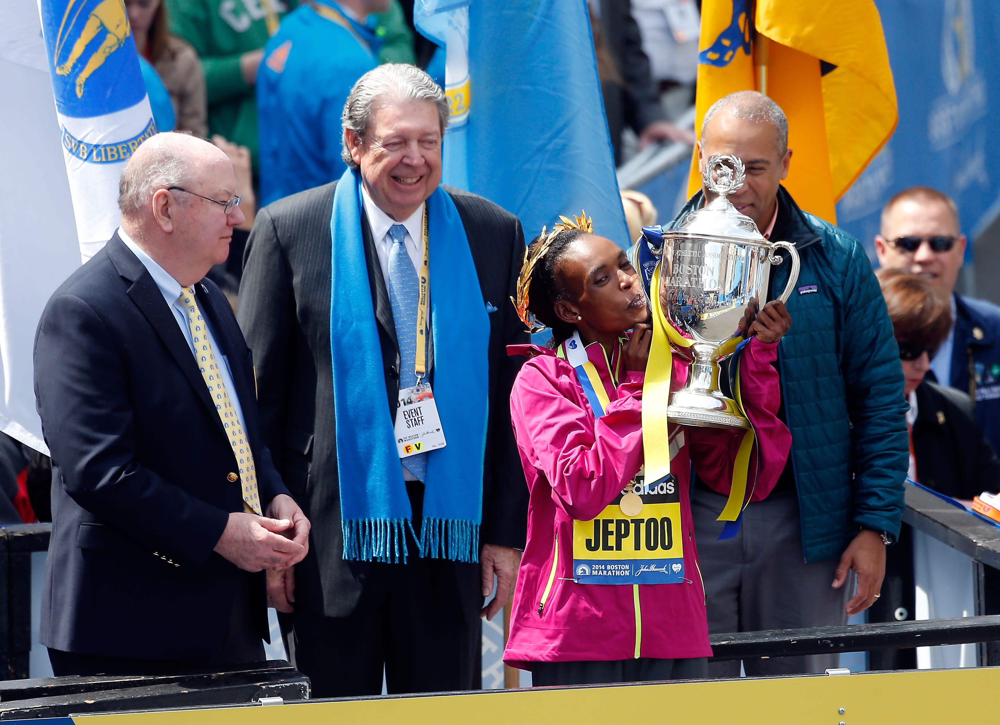 BOSTON, MA - APRIL 21: Rita Jeptoo of Kenya celebrates with the trophy after winning the 118th Boston Marathon on April 21, 2014 in Boston, Massachusetts. (Photo by Jim Rogash/Getty Images)