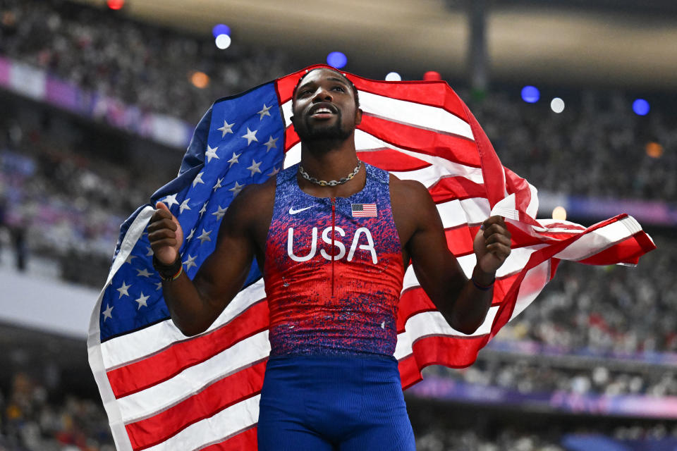 USA's Noah Lyles celebrates after winning the men's 100m final of the athletics event at the Paris 2024 Olympic Games at Stade de France in Saint-Denis, north of Paris, on August 4, 2024. (Photo by Jewel SAMAD / AFP) (Photo by JEWEL SAMAD/AFP via Getty Images)