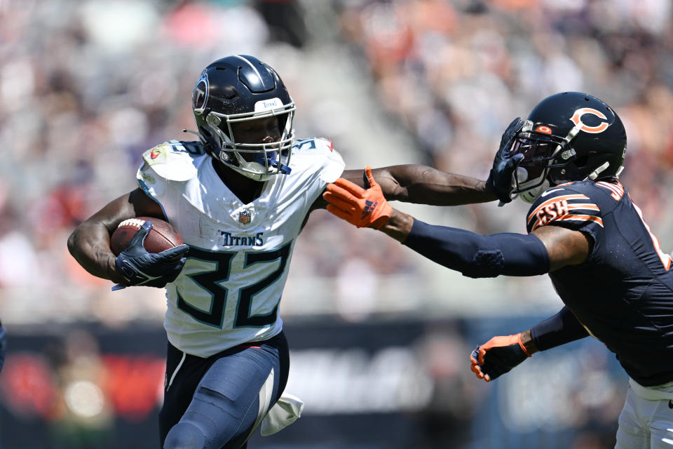 CHICAGO, ILLINOIS - AUGUST 12: Tyjae Spears #32 of the Tennessee Titans stiff arms Eddie Jackson #4 of the Chicago Bears in the first half during a preseason game at Soldier Field on August 12, 2023 in Chicago, Illinois. (Photo by Quinn Harris/Getty Images)