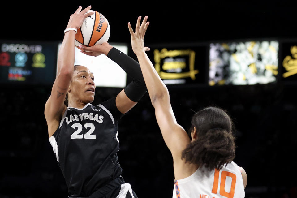 LAS VEGAS, NEVADA - SEPTEMBER 15: A'ja Wilson #22 of the Las Vegas Aces shoots against Olivia Nelson-Ododa #10 of the Connecticut Sun during the first quarter of a game at Michelob ULTRA Arena on September 15, 2024 in Las Vegas, Nevada. NOTE TO USER: User expressly acknowledges and agrees that, by downloading and or using this photograph, User is consenting to the terms and conditions of the Getty Images License Agreement. (Photo by Ian Maule/Getty Images)