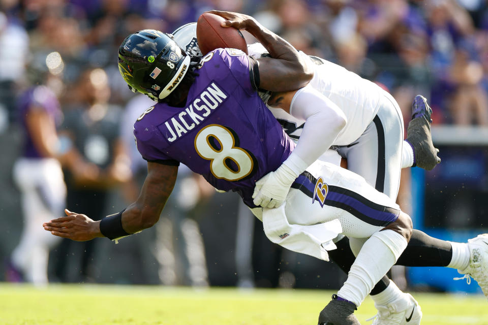 BALTIMORE, MARYLAND - SEPTEMBER 15: Maxx Crosby #98 of the Las Vegas Raiders sacks Lamar Jackson #8 of the Baltimore Ravens in the fourth quarter during an NFL football game at M&T Bank Stadium on September 15, 2024 in Baltimore, Maryland. (Photo by Brandon Sloter/Getty Images)