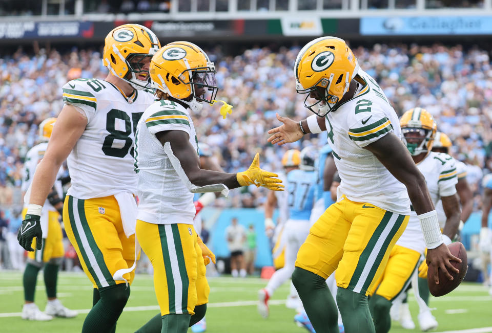 NASHVILLE, TENNESSEE - SEPTEMBER 22: Quarterback Malik Willis #2 of the Green Bay Packers celebrates a rushing touchdown with Jayden Reed #11 against the Tennessee Titans during the first quarter at Nissan Stadium on September 22, 2024 in Nashville, Tennessee. (Photo by Andy Lyons/Getty Images)