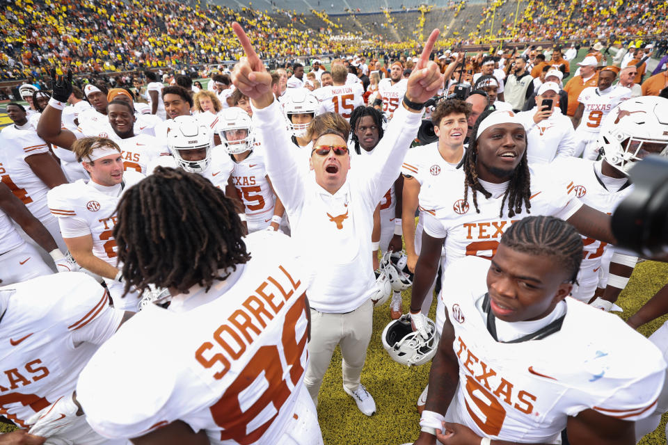 Texas coach Steve Sarkisian celebrates with his players after the Longhorns' win over Michigan on Saturday. (Gregory Shamus/Getty Images)