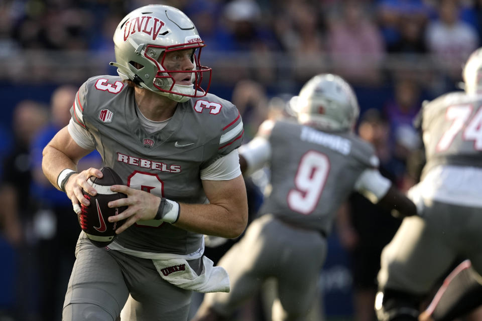 UNLV quarterback Matthew Sluka (3) looks to pass against Kansas in the first half of an NCAA college football game Friday, Sept. 13, 2024, at Children's Mercy Park in Kansas City, Kan. (AP Photo/Ed Zurga)