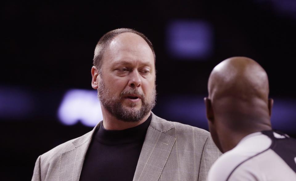 FILE - Brooklyn Nets assistant coach Joe Wolf talks with a referee during the second half of an NBA basketball game against the Detroit Pistons, Saturday, Jan. 9, 2016 in Auburn Hills, Mich. Joe Wolf, a former North Carolina captain who went on to play for seven teams in an 11-year NBA career and then became a coach, died unexpectedly on Thursday, the Milwaukee Bucks announced. (AP Photo/Carlos Osorio, File)