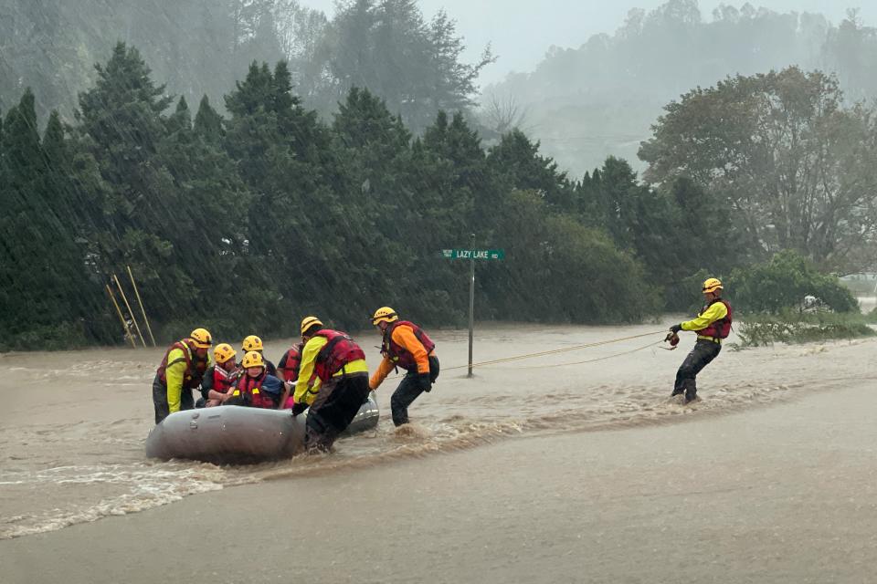 A swift water team rescues residents from severe flooding on Friday in Boone, North Carolina (REUTERS/Jonathan Drake)