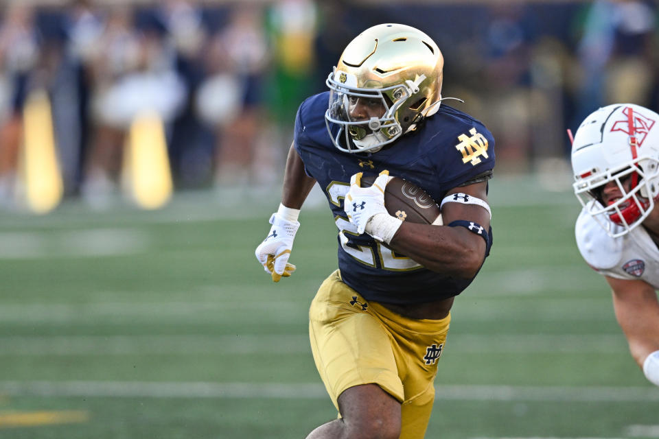 SOUTH BEND, IN - SEPTEMBER 21: Notre Dame Fighting Irish RB Devyn Ford (22) runs with the ball during a college football game between the Notre Dame Fighting Irish and Miami RedHawks on September 21, 2024 at Notre Dame Stadium in South Bend, IN (Photo by James Black/Icon Sportswire via Getty Images)