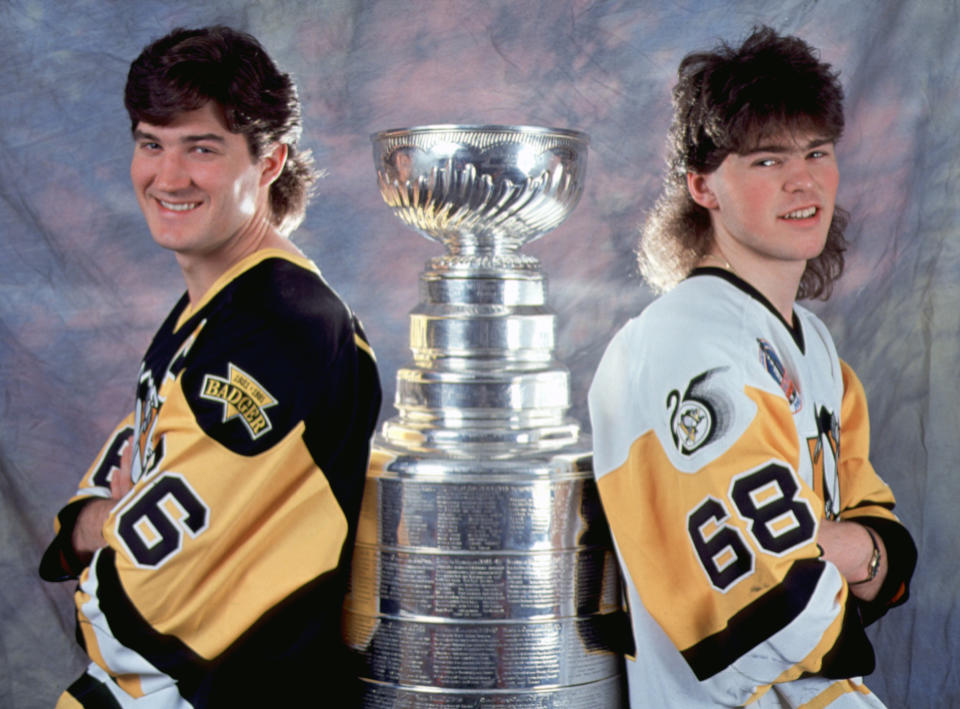 Canadian professional hockey player Mario Lemieux #66 (left) and Czech colleague Jaromir Jagr #68 of the Pittsburgh Penguins stand with the Stanley Cup, early 1990s. The Pens won the championship trophy in 1991 and 1992. (Photo by Bruce Bennett Studios via Getty Images Studios/Getty Images) 