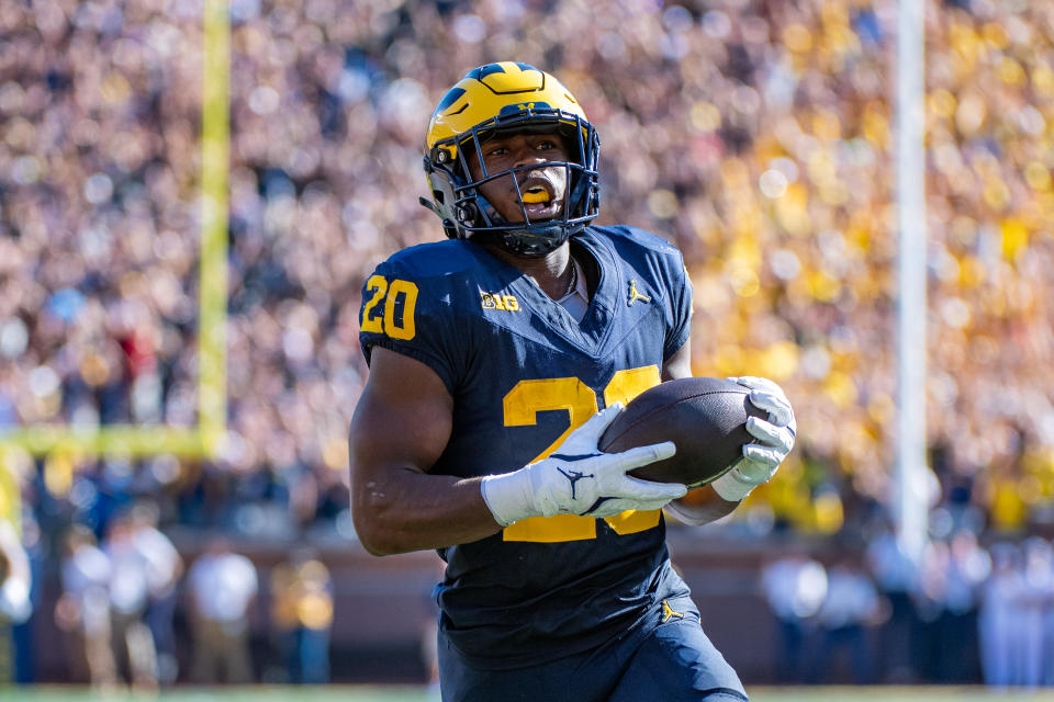 ANN ARBOR, MICHIGAN - SEPTEMBER 21: Kalel Mullings #20 of the Michigan Wolverines runs with the ball away from defenders for a touchdown during the first half of a college football game against the USC Trojans at Michigan Stadium on September 21, 2024 in Ann Arbor, Michigan. (Photo by Aaron J. Thornton/Getty Images)