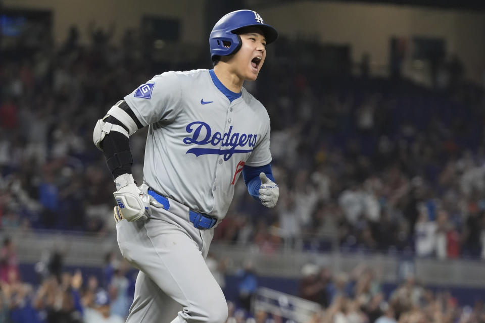 Shohei Ohtani's 50th home run ball bounced tantalizingly close to a fan in the left-field stands at loanDepot Park, but it was just out of reach. (AP Photo/Marta Lavandier)