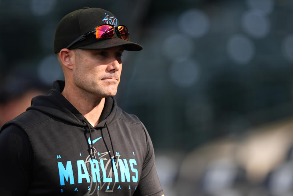 Miami Marlins manager Skip Schumaker (45) warms up before a baseball game Wednesday, Aug. 28, 2024, in Denver. (AP Photo/David Zalubowski)