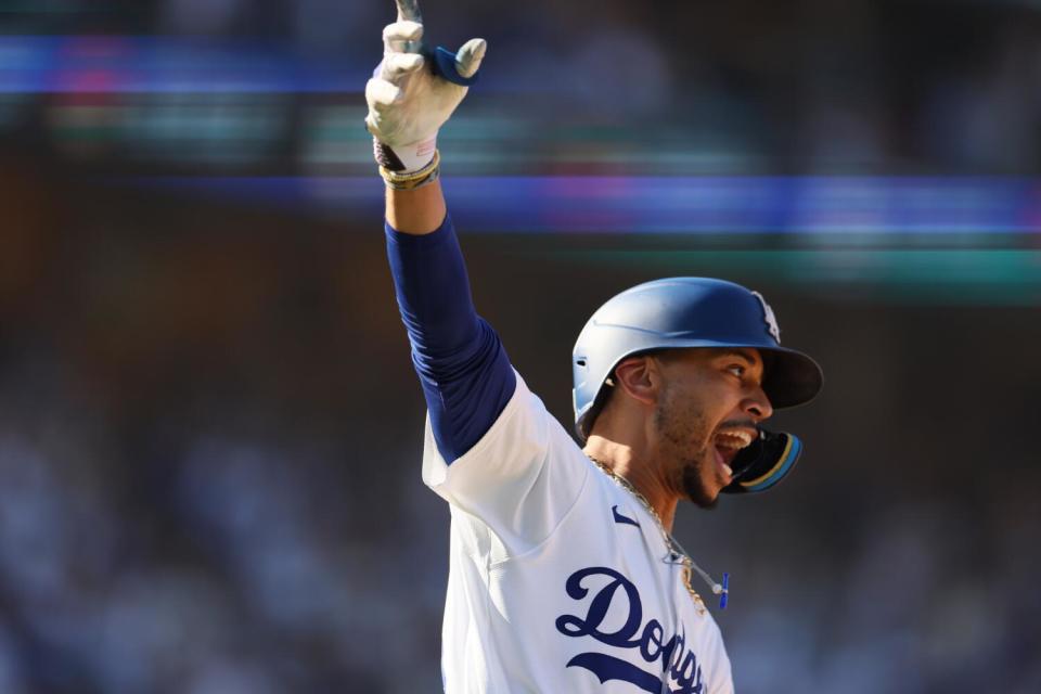 Mookie Betts celebrates his walkoff home run in the ninth inning against Colorado on Sunday./