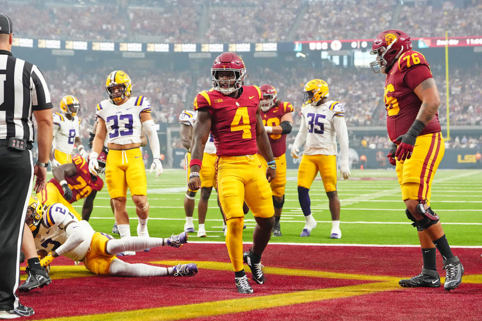 Sep 1, 2024; Paradise, Nevada, USA; Southern California Trojans running back Woody Marks (4) celebrates after scoring a touchdown against the LSU Tigers during the second quarter at Allegiant Stadium. Mandatory Credit: Stephen R. Sylvanie-USA TODAY Sports