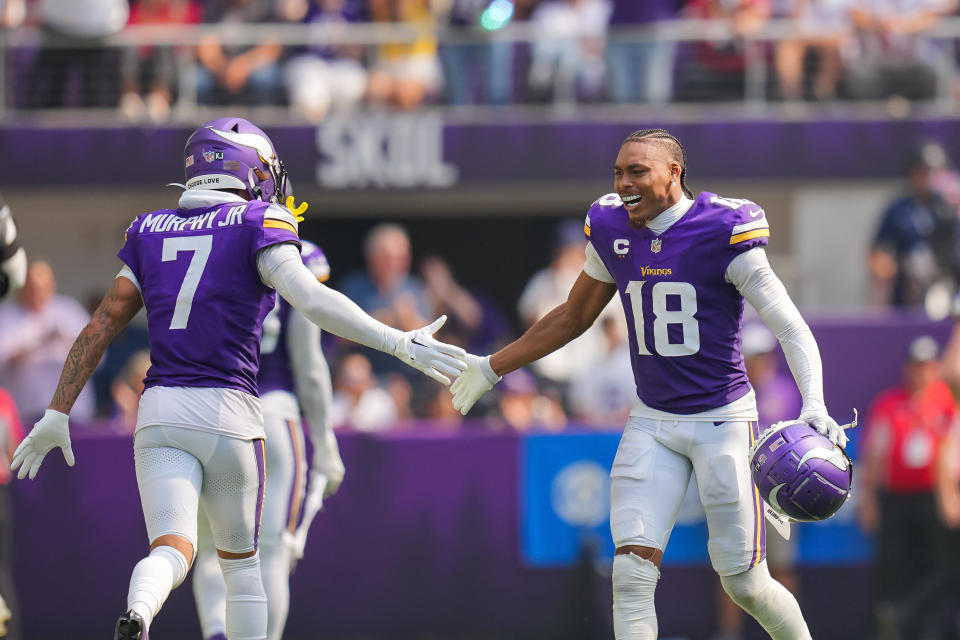 Sep 15, 2024; Minneapolis, Minnesota, USA; Minnesota Vikings wide receiver Justin Jefferson (18) celebrates an interception with cornerback Byron Murphy Jr. (7) against the San Francisco 49ers in the third quarter at U.S. Bank Stadium. Mandatory Credit: Brad Rempel-Imagn Images