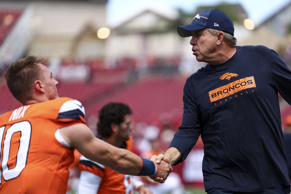 TAMPA, FL - SEPTEMBER 22: Head coach Sean Payton of the Denver Broncos shakes hands with Bo Nix #10 prior to an NFL football game against the Tampa Bay Buccaneers at Raymond James Stadium on September 22, 2024 in Tampa, Florida. (Photo by Kevin Sabitus/Getty Images)