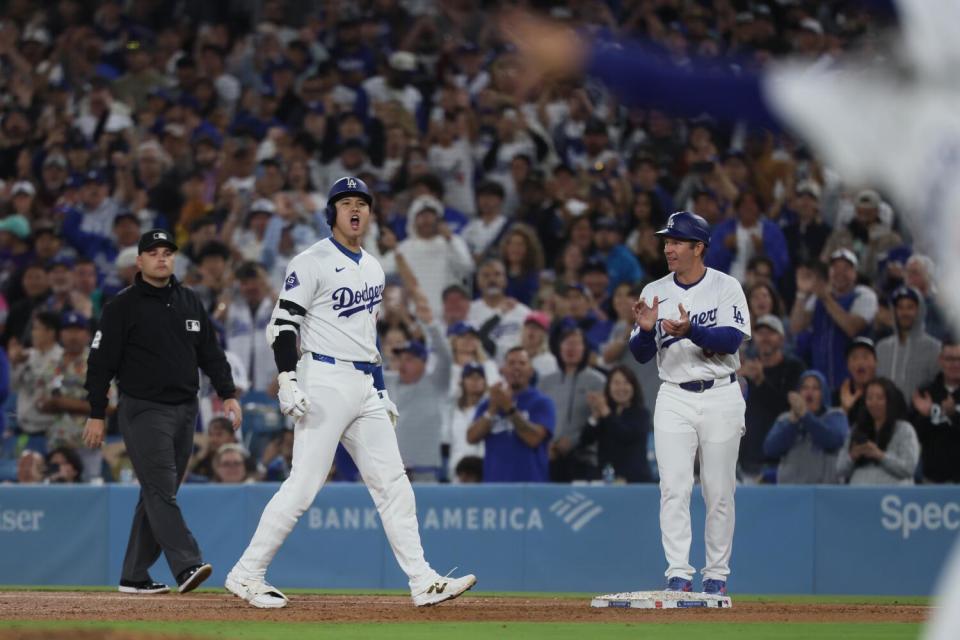 Dodgers designated hitter Shohei Ohtani shouts after hitting an RBI single in the sixth inning against the Padres.