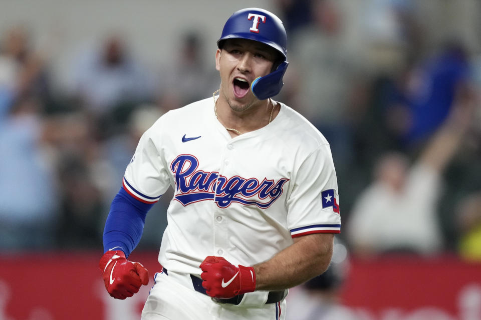 ARLINGTON, TEXAS - SEPTEMBER 03: Wyatt Langford #36 of the Texas Rangers reacts as he runs the bases after hitting a walk off grand slam to defeat the New York Yankees at Globe Life Field on September 03, 2024 in Arlington, Texas. (Photo by Sam Hodde/Getty Images)