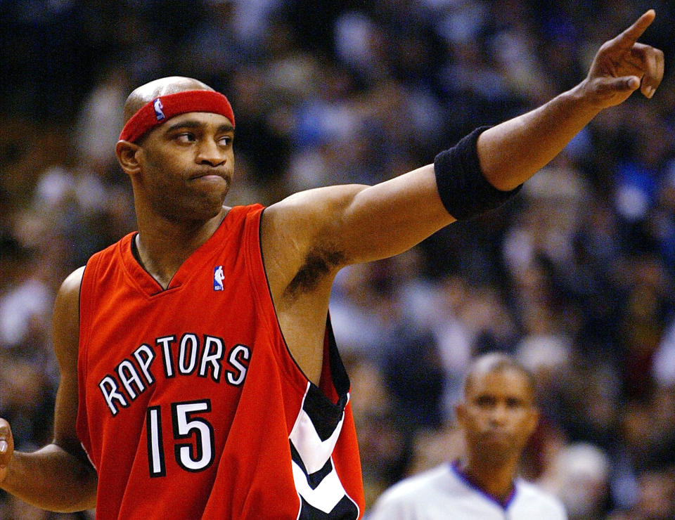 TORONTO - NOVEMBER 3: Vince Carter #15 of the Toronto Raptors salutes the crowd after beating the Houston Rockets 95-88 during a game at the Air Canada Centre on November 3, 2003 in Toronto, Canada. NOTE TO USER: User expressly acknowledges and agrees that, by downloading and or using this photograph, User is consenting to the terms and conditions of the Getty Images License Agreement. (Photo by Dave Sandford/Getty Images)