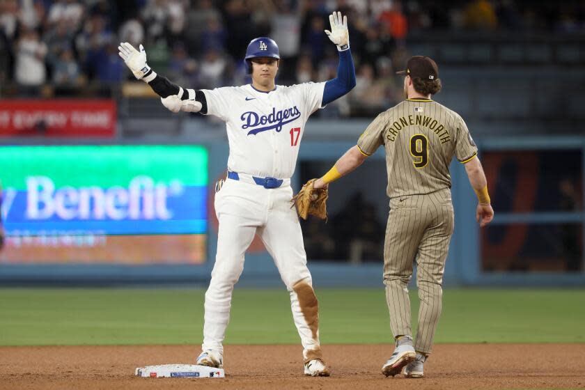 Shohei Ohtani celebrates after becoming the first player in 23 years to reach 400 total bases in a season