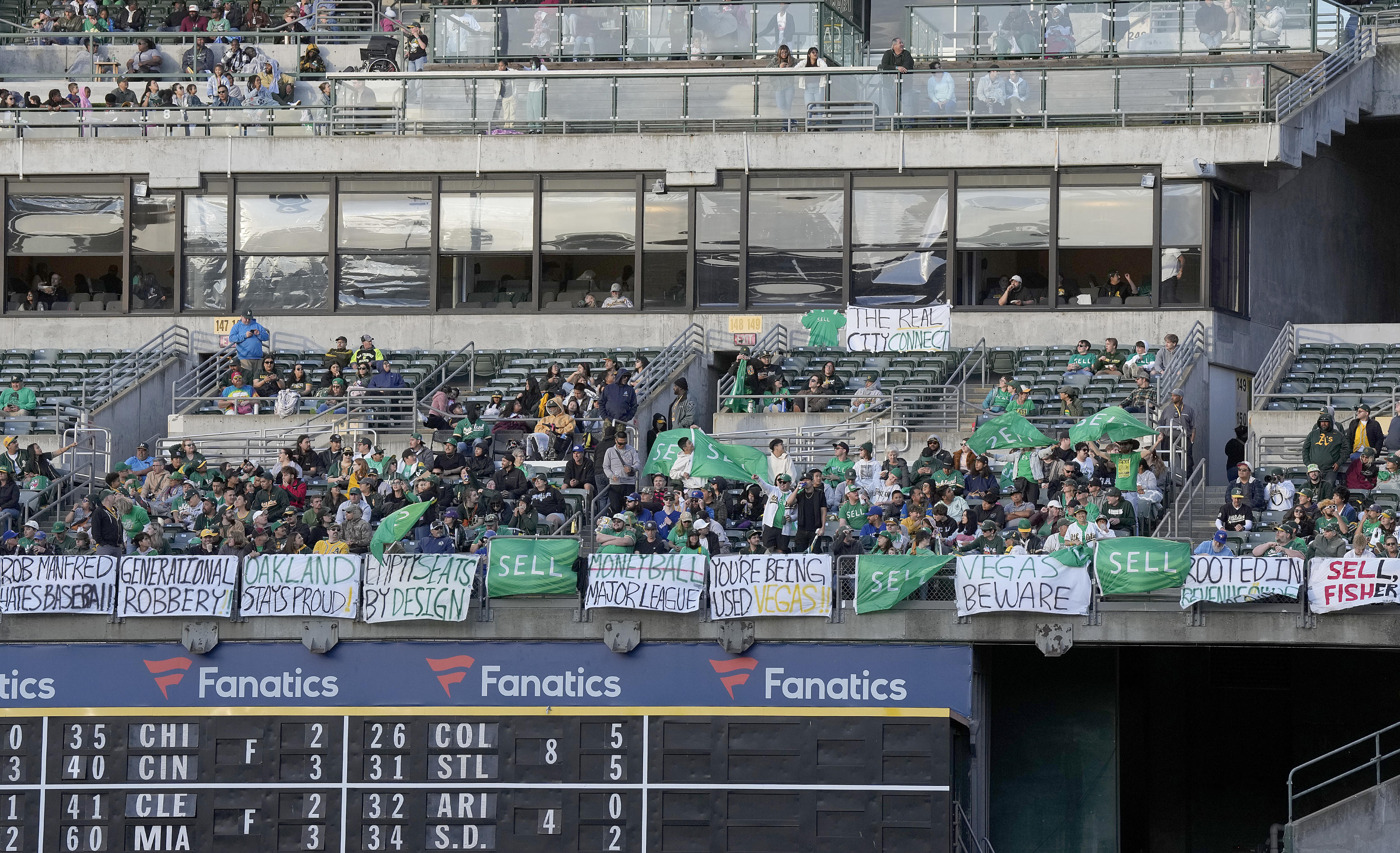 OAKLAND, CALIFORNIA - JUNE 07: Oakland Athletics fans display their flags and signs while chanting 