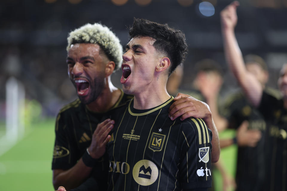 LOS ANGELES, CALIFORNIA - SEPTEMBER 25: Omar Campos #2 of Los Angeles FC celebrates his goal with Timothy Tillman #11 during extra time of the finals against Sporting Kansas City during the 2024 Lamar Hunt U. S. Open Cup at BMO Stadium on September 25, 2024 in Los Angeles, California. (Photo by Michael Owens/USSF/Getty Images for USSF)