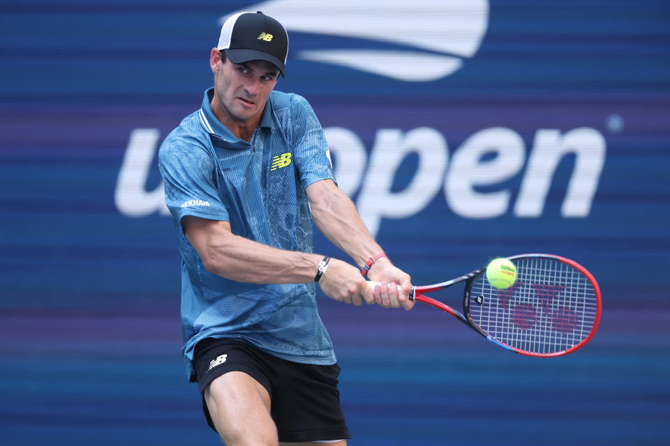 NEW YORK, NEW YORK - AUGUST 31: Tommy Paul of the United States returns a shot against Gabriel Diallo of Canada during their Men's Singles Third Round match on Day Six of the 2024 US Open at USTA Billie Jean King National Tennis Center on August 31, 2024 in the Flushing neighborhood of the Queens borough of New York City. (Photo by Matthew Stockman/Getty Images)