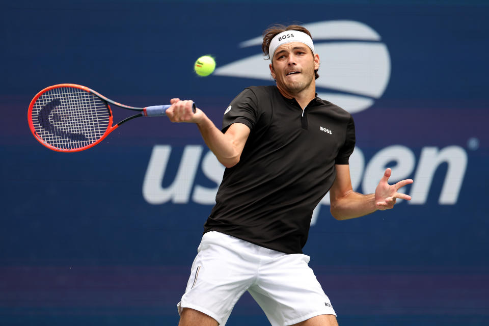 NEW YORK, NEW YORK - AUGUST 30: Taylor Fritz of the United States returns a shot against Francisco Comesana of Argentina during their Men's Singles Third Round match on Day Five of the 2024 US Open at USTA Billie Jean King National Tennis Center on August 30, 2024 in the Flushing neighborhood of the Queens borough of New York City. (Photo by Luke Hales/Getty Images)