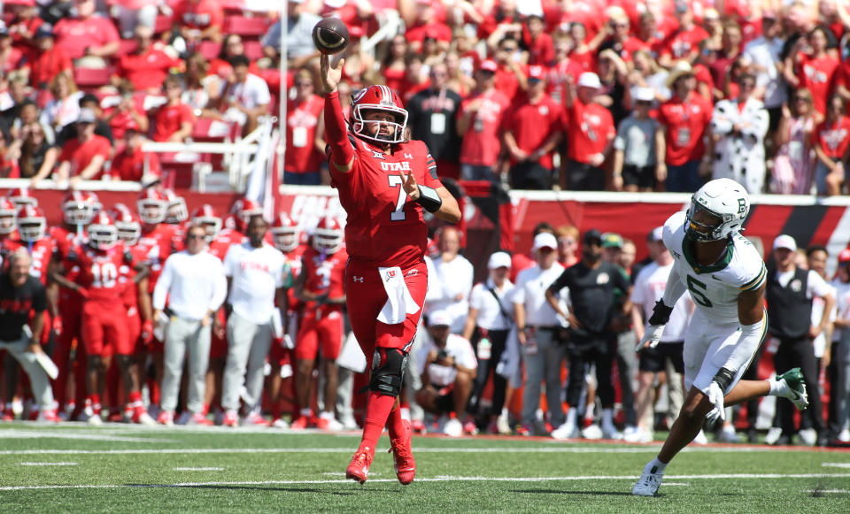 SALT LAKE CITY, UT - SEPTEMBER 7: Cameron Rising #7 of the Utah Utes throws a touchdown pass under pressure from Garmon Randolph #5 of the Baylor Bears during the first half of their game at Rice Eccles Stadium on September 7, 2024 in Salt Lake City, Utah.(Photo by Chris Gardner/Getty Images)