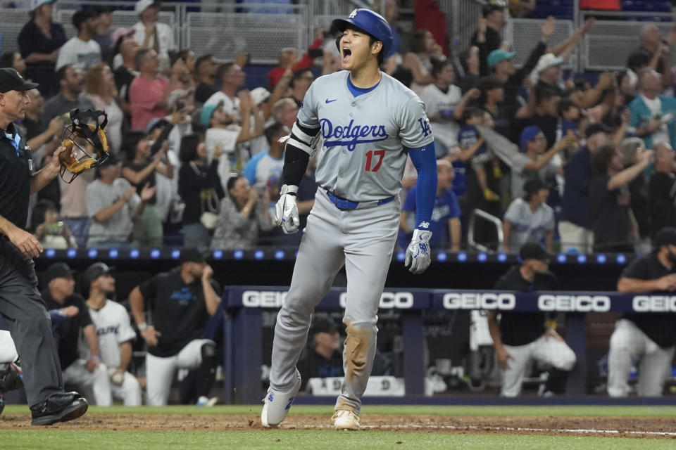 On Thursday in Miami, Shohei Ohtani hit his 49th and 50th home runs of the season, after stealing his 50th and 51st bases, to stand alone in MLB history. (AP Photo/Marta Lavandier)