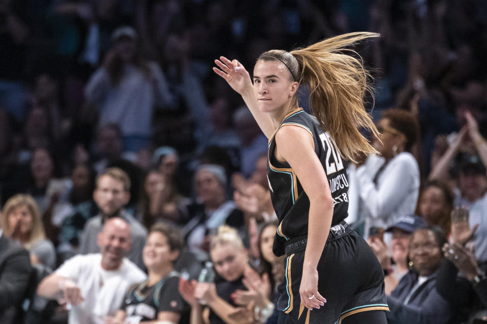 New York Liberty guard Sabrina Ionescu (20) celebrates after a 3-point basket during the first half of a WNBA basketball first-round playoff game against the Atlanta Dream, Sunday, Sept. 22, 2024, in New York. (AP Photo/Corey Sipkin)