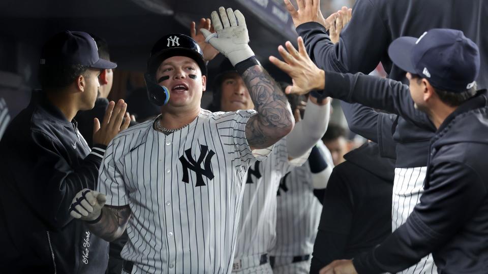 Sep 9, 2024; Bronx, New York, USA; New York Yankees left fielder Alex Verdugo (24) celebrates his two run home run against the Kansas City Royals with teammates in the dugout during the fourth inning at Yankee Stadium.