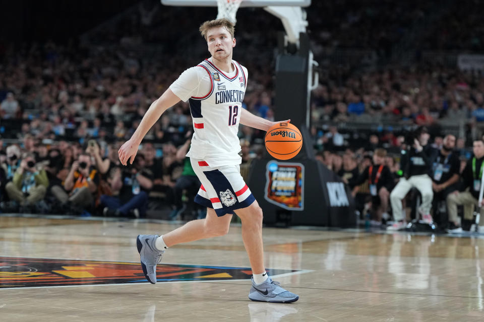 GLENDALE, ARIZONA - APRIL 08: Cam Spencer #12 of the Connecticut Huskies dribbles the ball during the National College Basketball Championship game against the Purdue Boilermakers at State Farm Stadium on April 08, 2024 in Glendale, Arizona. (Photo by Mitchell Layton/Getty Images)