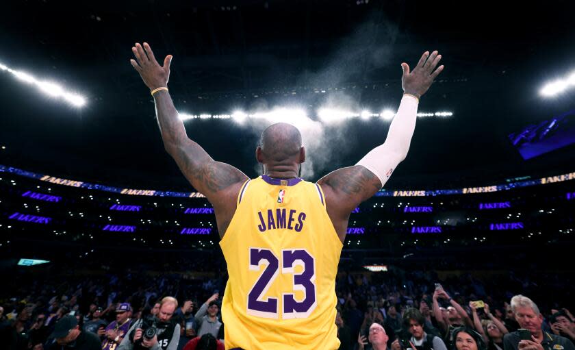 Los Angeles, California November 13, 2024-Lakers LeBron James tosses the chalk into the air before a game with the Grizzlies at Crypto.com Arena Wednesday. (Wally Skalij/Los Angeles Times)