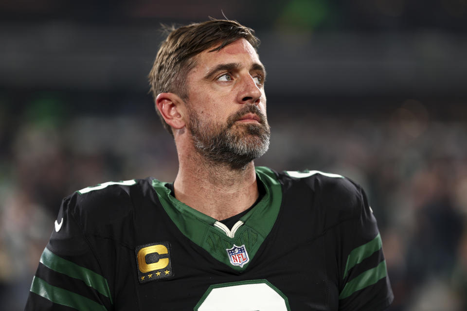 EAST RUTHERFORD, NEW JERSEY - OCTOBER 31: Aaron Rodgers #8 of the New York Jets stands on the sidelines during the national anthem prior to an NFL football game against the Houston Texans, at MetLife Stadium on October 31, 2024 in East Rutherford, New Jersey. (Photo by Kevin Sabitus/Getty Images)