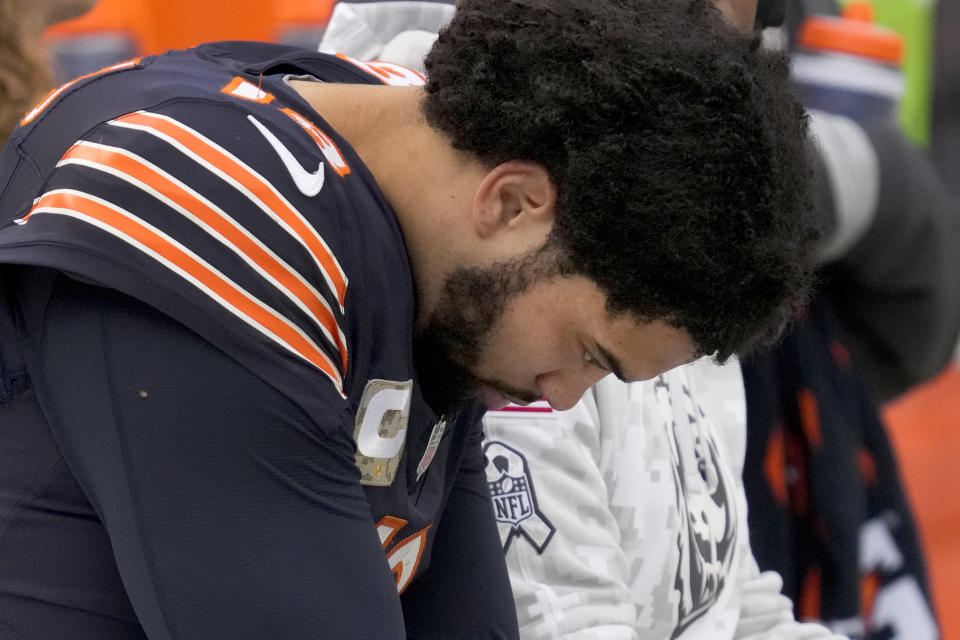 Chicago Bears quarterback Caleb Williams sits on the bench in the closing minutes of an NFL football game against the New England Patriots on Sunday, Nov. 10, 2024, in Chicago. (AP Photo/Nam Y. Huh)