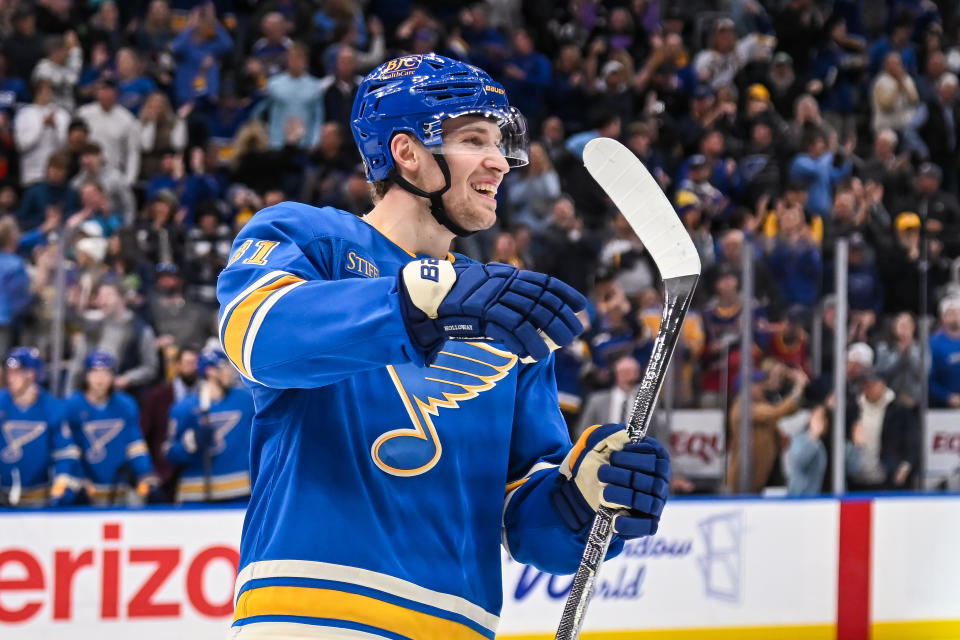 ST. LOUIS, MO - NOVEMBER 02: St. Louis Blues center Dylan Holloway assists on his teams third goal of the game during a regular season game where the St. Louis Blues hosted the Toronto Maple Leafs. (Photo by Rick Ulreich/Icon Sportswire via Getty Images)